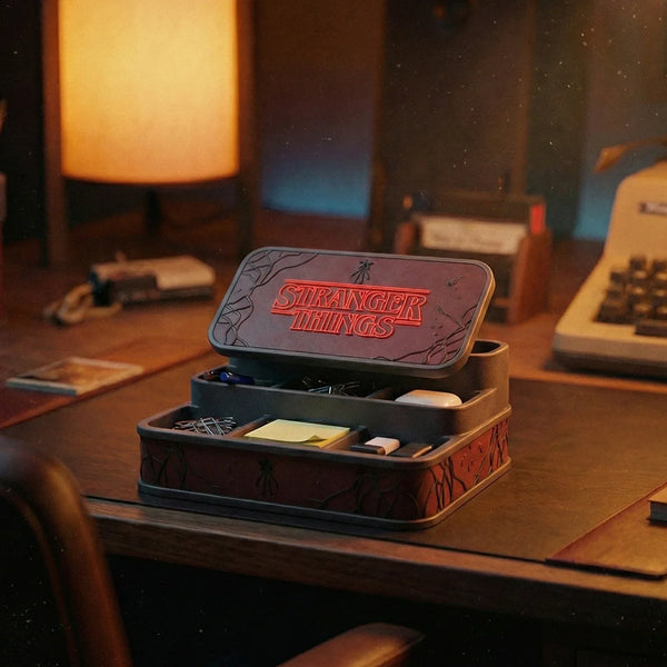 Stranger Things themed desktop organizer box holding office supplies on a workspace desk